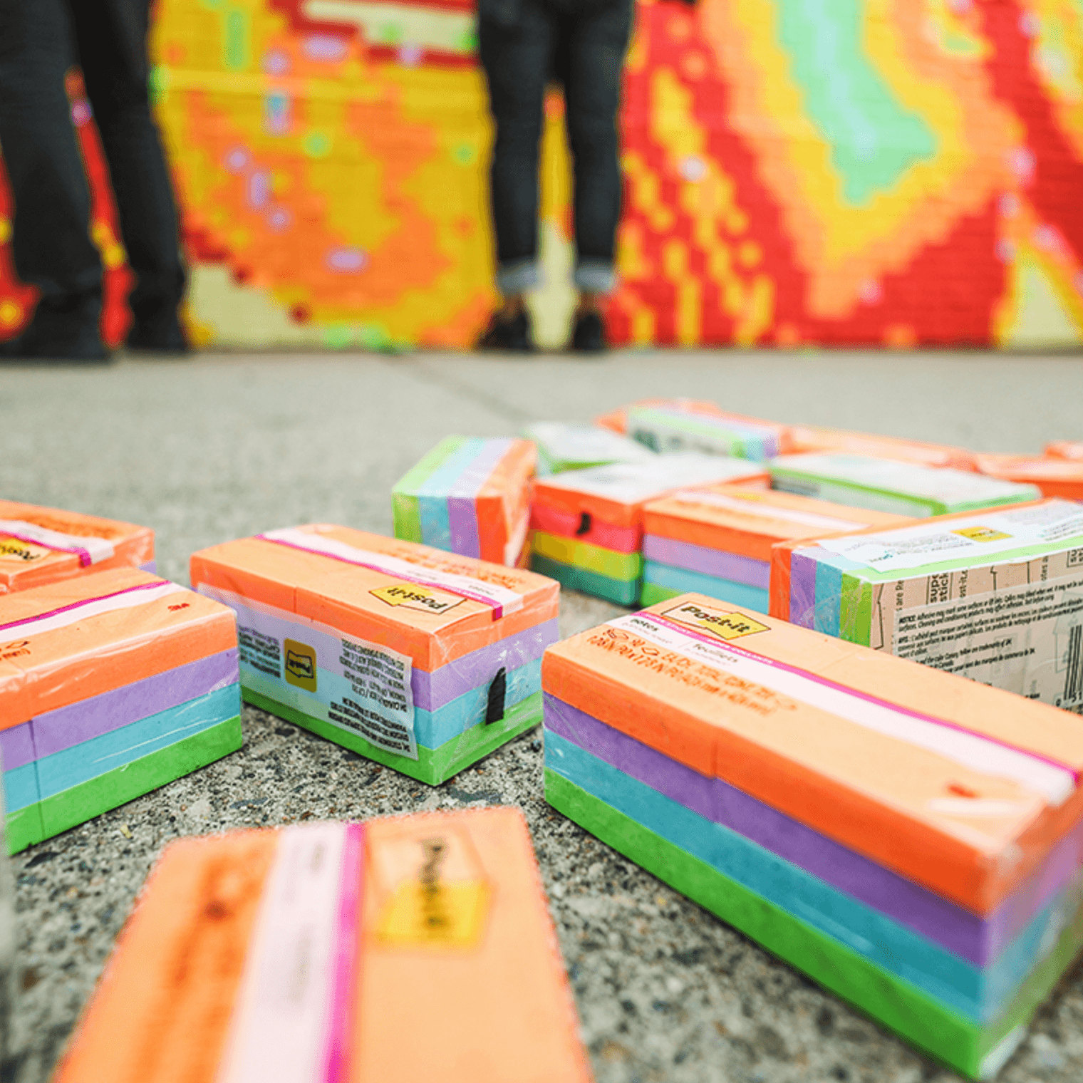 a photo of 3M creating their post it note mural
